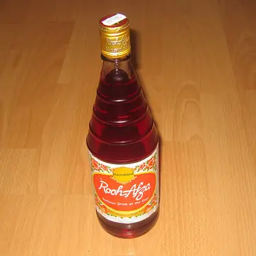 A bottle of ruby-red rose syrup.